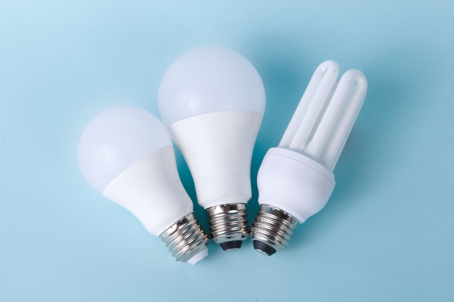 white light bulbs on a blue surface